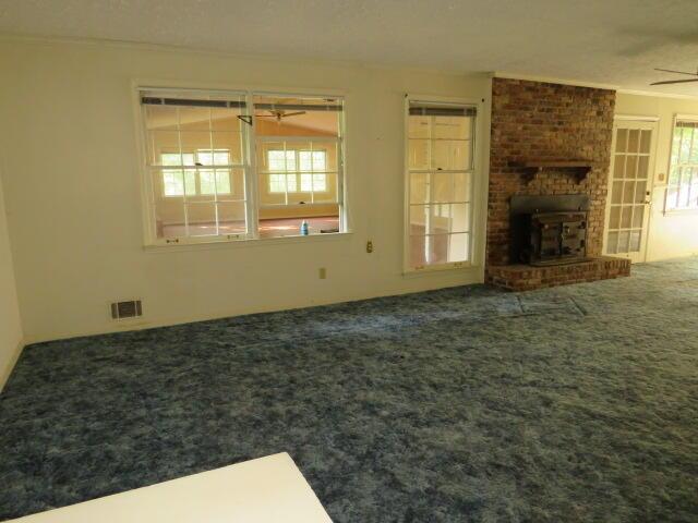 4629 Silver Lake Dr, Evans, GA 30809 - unfurnished living room featuring carpet and visible vents
