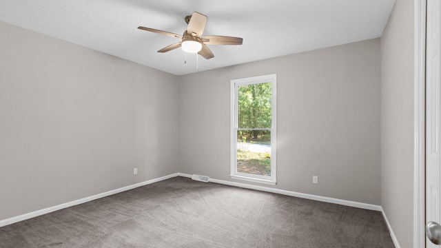 carpeted empty room with ceiling fan