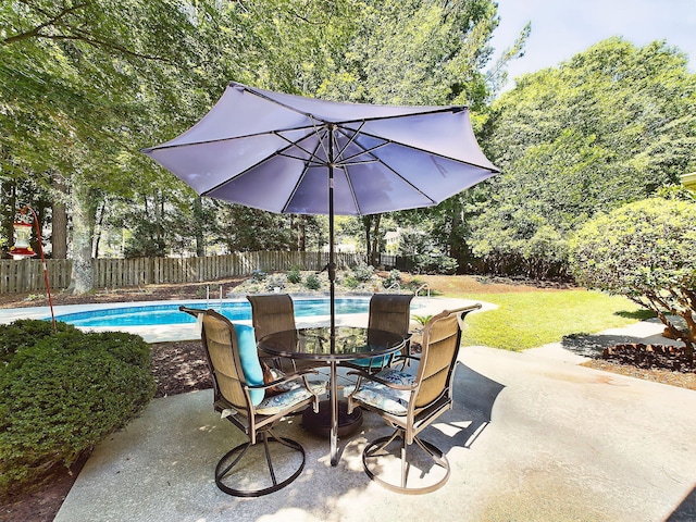 view of patio featuring a fenced in pool