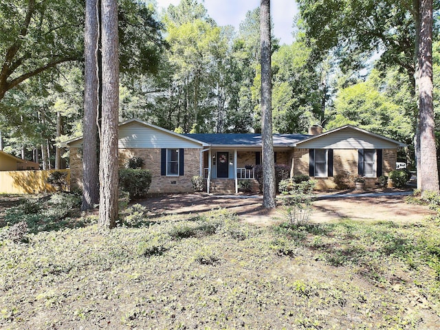 ranch-style home featuring covered porch