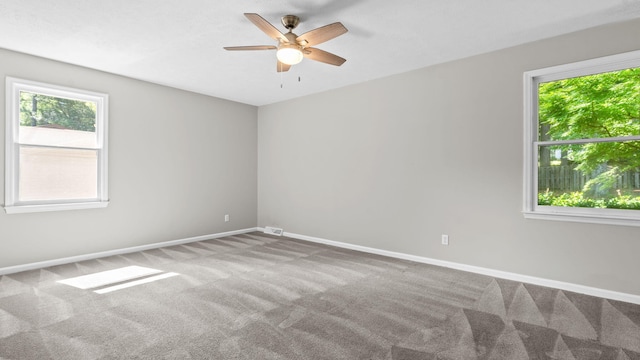 unfurnished room featuring carpet floors and ceiling fan