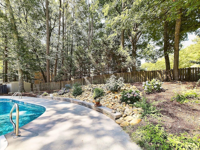 view of swimming pool featuring a patio