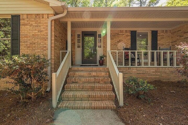 property entrance with covered porch