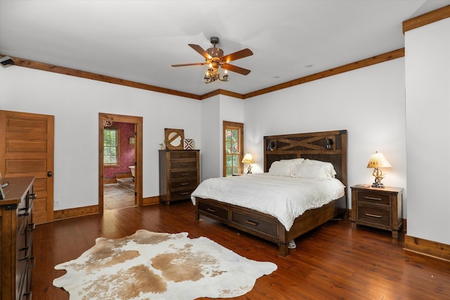 bedroom with dark hardwood / wood-style flooring, ensuite bathroom, ceiling fan, and ornamental molding