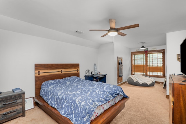 bedroom featuring ceiling fan, carpet floors, and vaulted ceiling