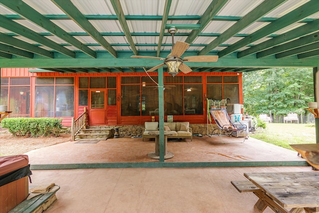 view of patio / terrace featuring ceiling fan and a sunroom