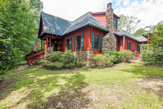 view of home's exterior with a yard