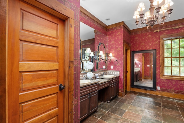 bathroom featuring vanity and a notable chandelier