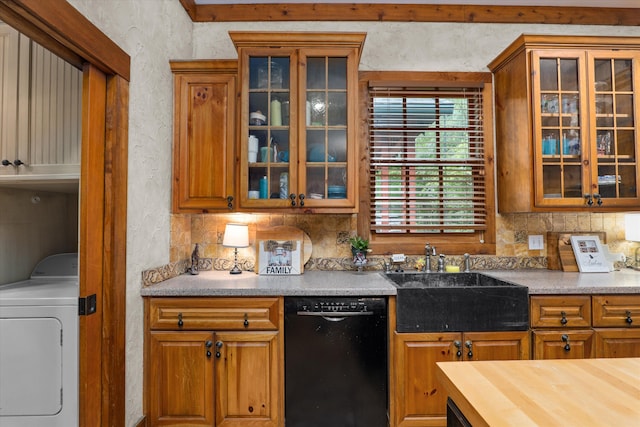 kitchen with washer / clothes dryer, dishwasher, wood counters, and sink