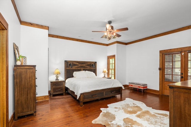 bedroom with dark hardwood / wood-style floors, ceiling fan, and ornamental molding