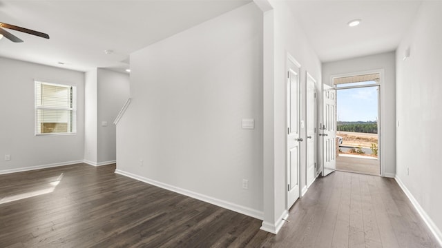 corridor featuring dark hardwood / wood-style floors