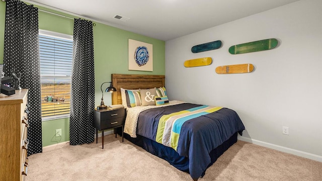 bedroom with light colored carpet