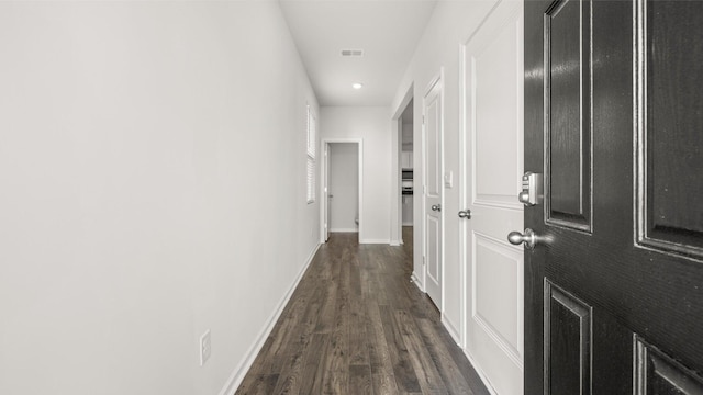 hall featuring dark wood-type flooring