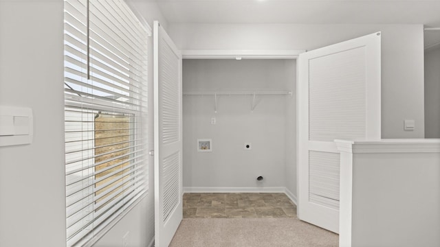 clothes washing area with electric dryer hookup, hookup for a washing machine, and light colored carpet