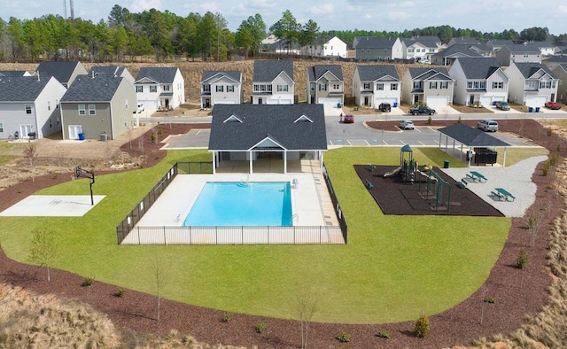 view of swimming pool with a yard and a patio area