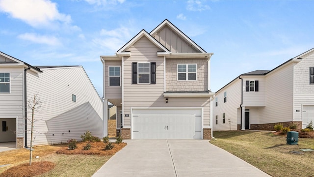 craftsman-style home with a garage and a front yard