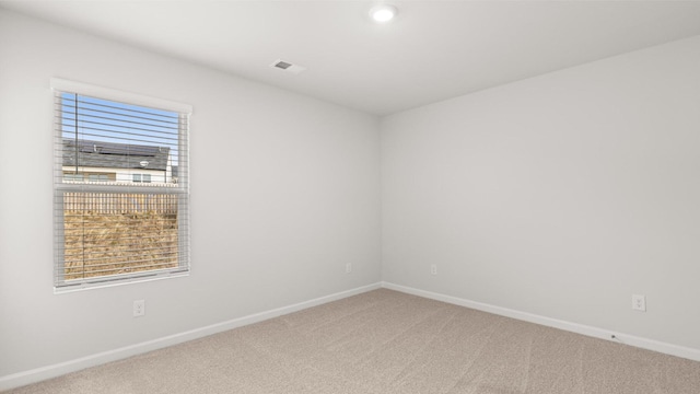 unfurnished room with carpet flooring