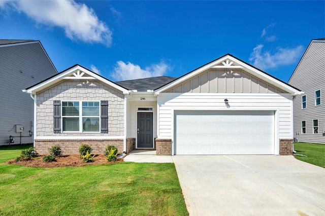 view of front of property with a garage and a front yard