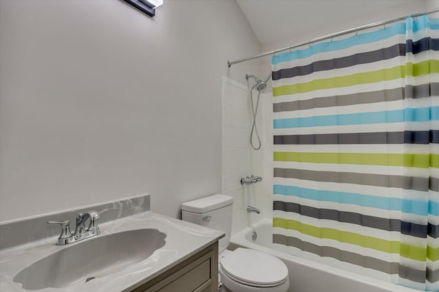 full bathroom featuring vanity, shower / bathtub combination with curtain, and toilet