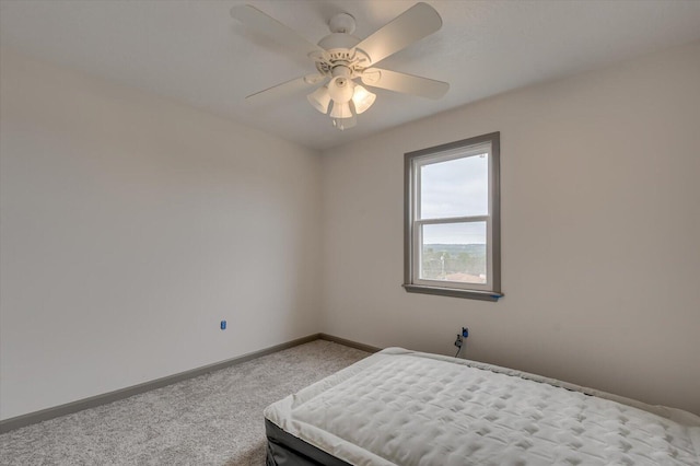 unfurnished bedroom with light carpet and ceiling fan