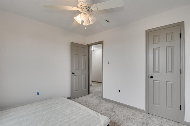 carpeted bedroom featuring ceiling fan