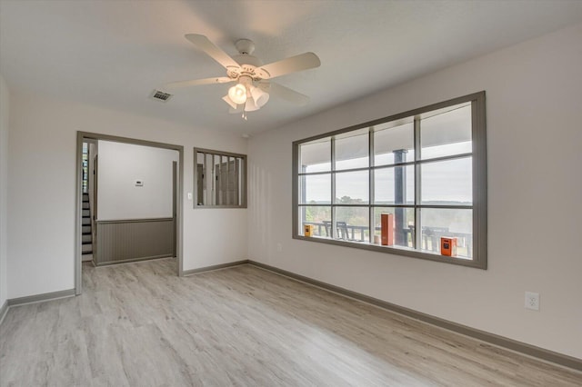 spare room with ceiling fan and light hardwood / wood-style flooring