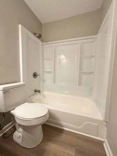 2060 Morning Dr, Augusta, GA 30906 - full bath featuring wood finished floors, toilet, and washtub / shower combination