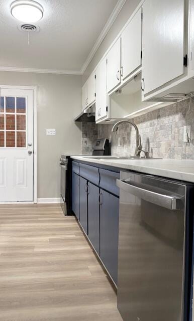 2060 Morning Dr, Augusta, GA 30906 - kitchen with appliances with stainless steel finishes, ornamental molding, light wood finished floors, a sink, and light countertops