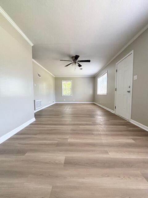 2060 Morning Dr, Augusta, GA 30906 - empty room with crown molding, ceiling fan, baseboards, and light wood-style floors