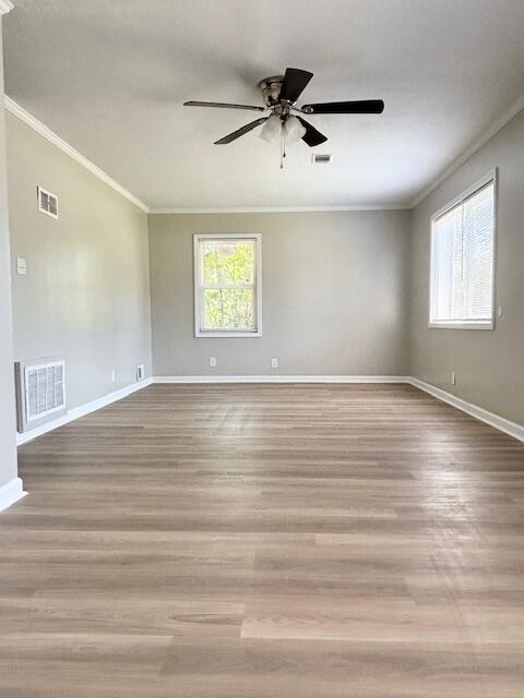 2060 Morning Dr, Augusta, GA 30906 - spare room featuring crown molding, a ceiling fan, baseboards, and wood finished floors