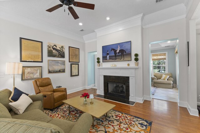108 Pine Needle Rd, Aiken, SC 29803 - living area with ceiling fan, ornamental molding, wood finished floors, a glass covered fireplace, and recessed lighting