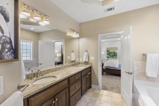 108 Pine Needle Rd, Aiken, SC 29803 - ensuite bathroom with double vanity, tile patterned flooring, a garden tub, and baseboards