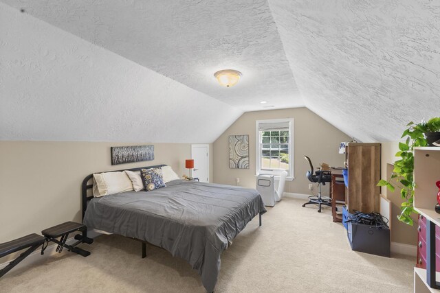 108 Pine Needle Rd, Aiken, SC 29803 - carpeted bedroom featuring a textured ceiling, vaulted ceiling, and baseboards