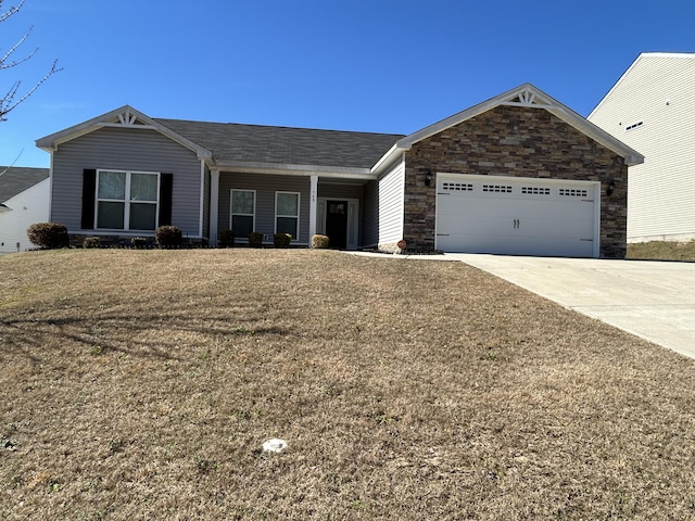 ranch-style house featuring a garage, stone siding, a front yard, and driveway