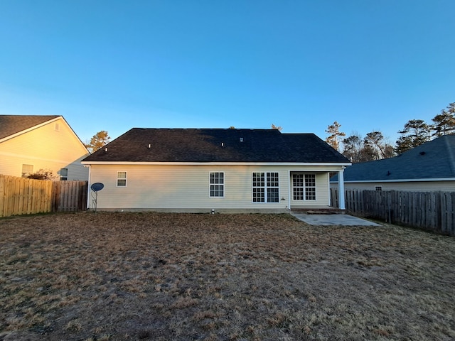 rear view of property featuring a patio area