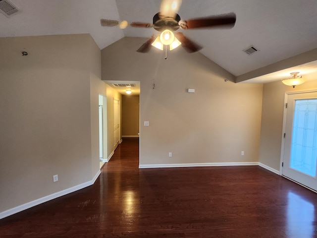 empty room featuring ceiling fan, lofted ceiling, and dark hardwood / wood-style floors