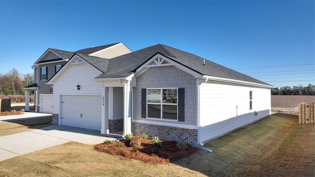 view of front of property featuring a front lawn and a garage