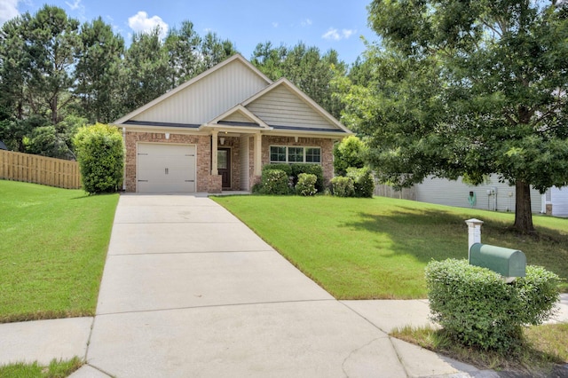 2306 Peach Blossom Pass, Hephzibah, GA 30815 - craftsman house with brick siding, concrete driveway, and an attached garage