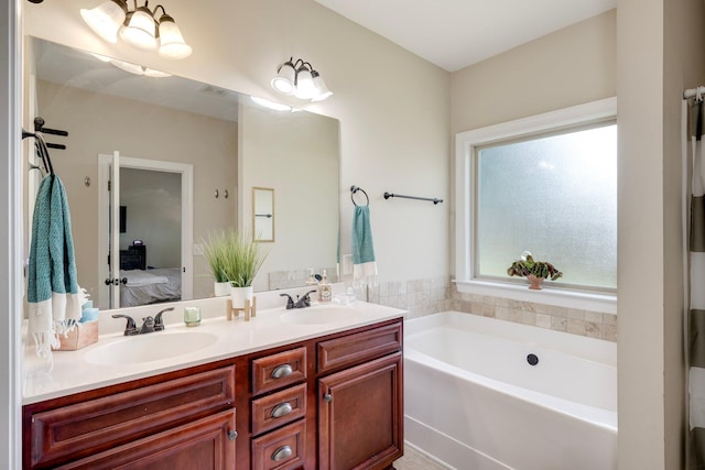 2306 Peach Blossom Pass, Hephzibah, GA 30815 - full bathroom featuring double vanity, a bath, and ensuite bath