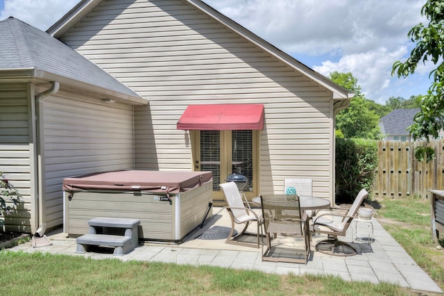 2306 Peach Blossom Pass, Hephzibah, GA 30815 - back of property featuring a hot tub and a patio
