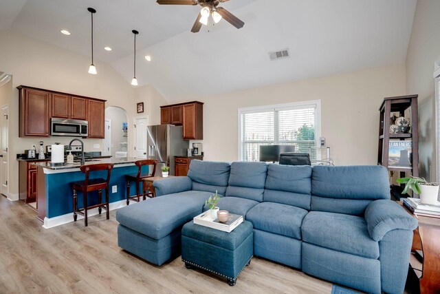 2306 Peach Blossom Pass, Hephzibah, GA 30815 - living room with a ceiling fan, arched walkways, light wood-style flooring, high vaulted ceiling, and recessed lighting