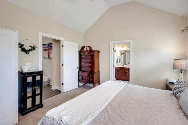 2306 Peach Blossom Pass, Hephzibah, GA 30815 - bedroom with light carpet, high vaulted ceiling, and connected bathroom