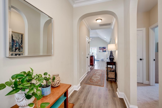2306 Peach Blossom Pass, Hephzibah, GA 30815 - corridor featuring arched walkways, crown molding, wood finished floors, and lofted ceiling