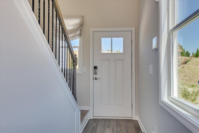 entryway with dark hardwood / wood-style floors