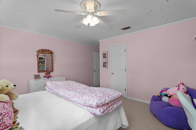 bedroom with ceiling fan, carpet floors, baseboards, visible vents, and ornamental molding