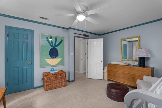carpeted bedroom with a ceiling fan, baseboards, visible vents, and ornamental molding