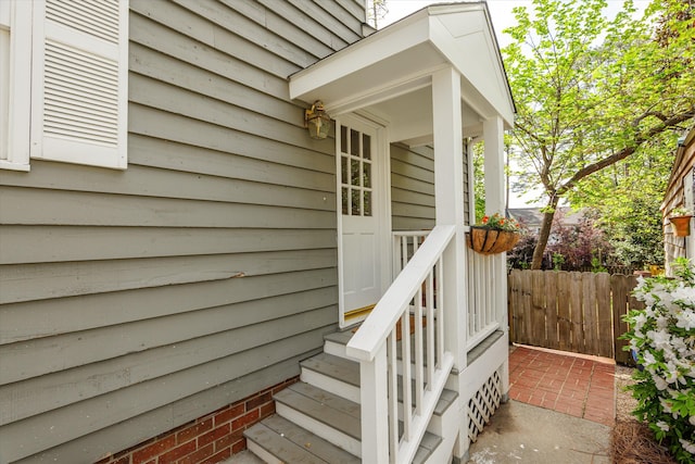 doorway to property with fence