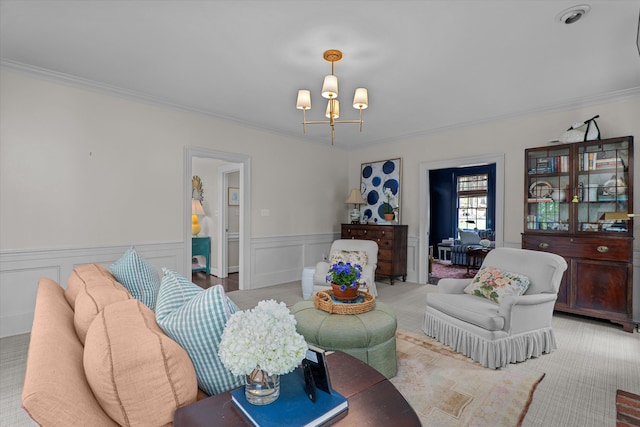 living area featuring crown molding, a wainscoted wall, carpet floors, and a notable chandelier