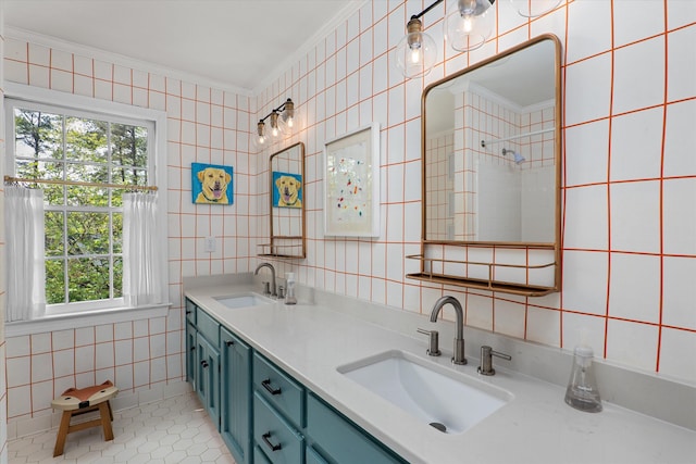 full bathroom with a sink, tile walls, ornamental molding, and tile patterned floors