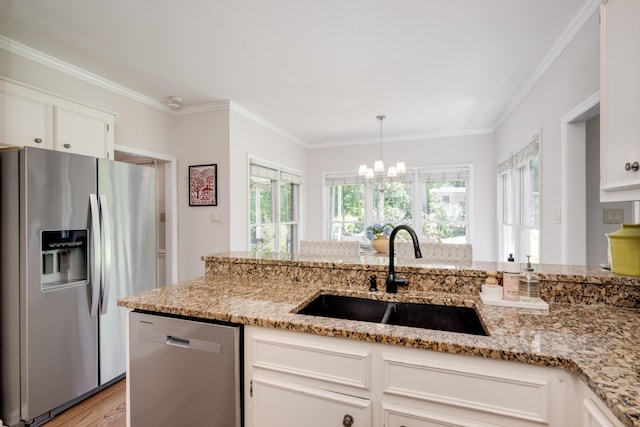 467 Baker Woods Trl, Martinez, GA 30907 - kitchen with a notable chandelier, light stone counters, a sink, stainless steel appliances, and white cabinetry
